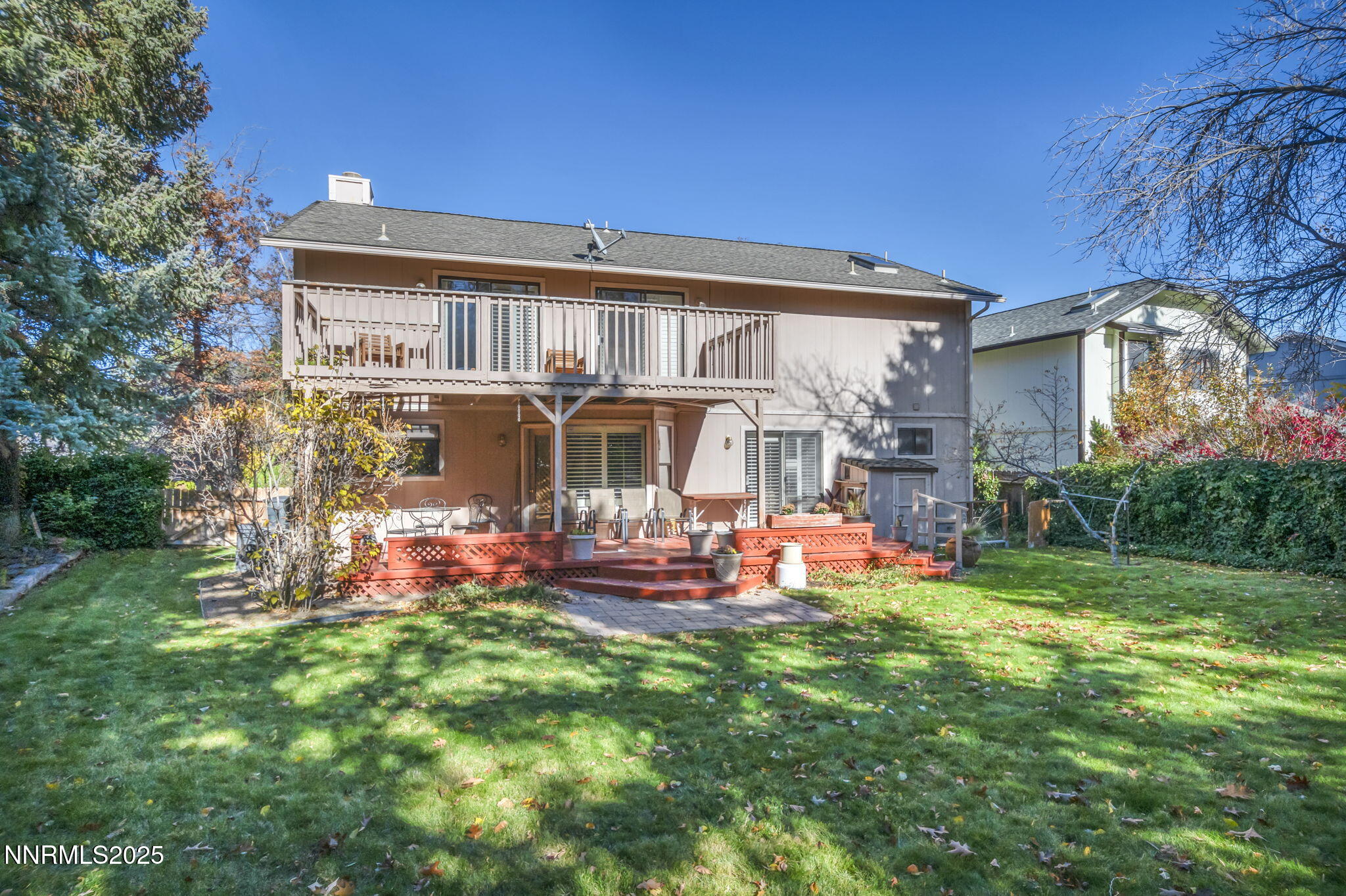6299 Stone Valley Drive Reno, NV 89523 - Photo 46 of 70 a front view of a house with a yard table and chairs