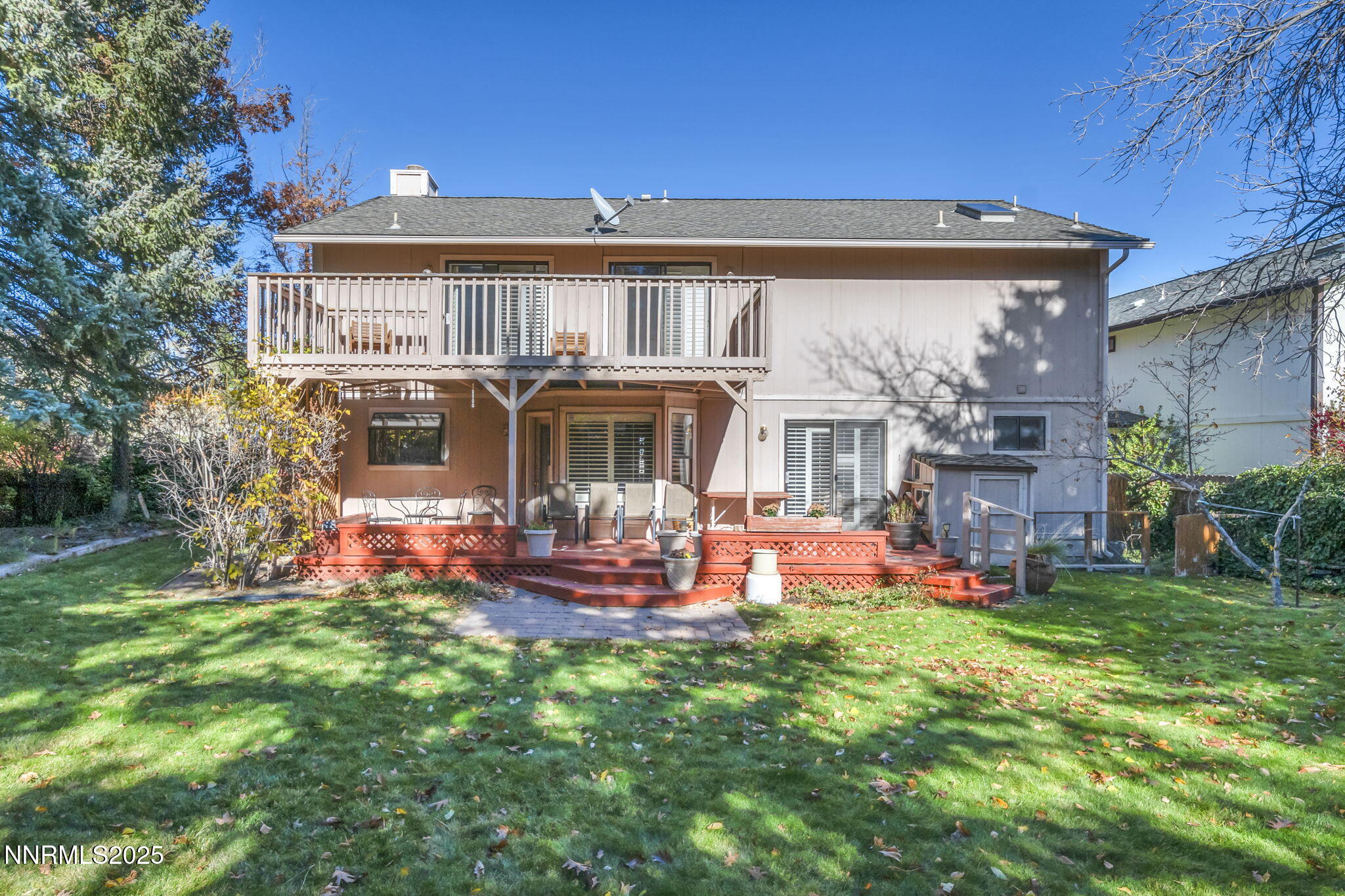 6299 Stone Valley Drive Reno, NV 89523 - Photo 47 of 70 a front view of a house with a yard table and chairs