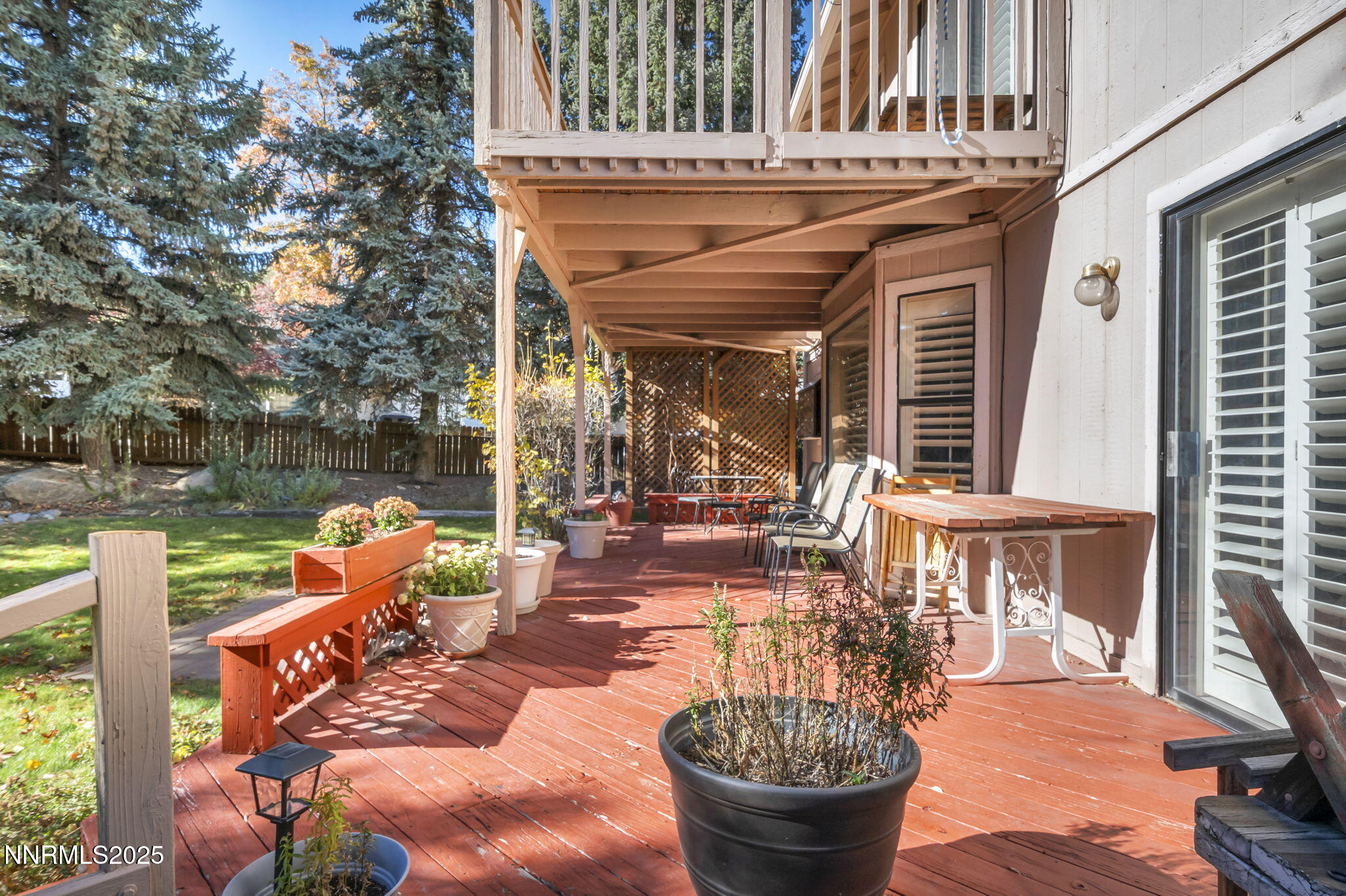 6299 Stone Valley Drive Reno, NV 89523 - Photo 50 of 70 a view of a patio with chairs and a potted plant