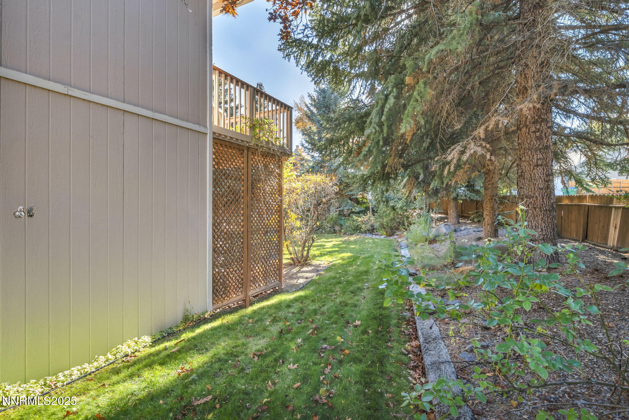 6299 Stone Valley Drive Reno, NV 89523 - Photo 53 of 70 a backyard of a house with lots of green space and garden view
