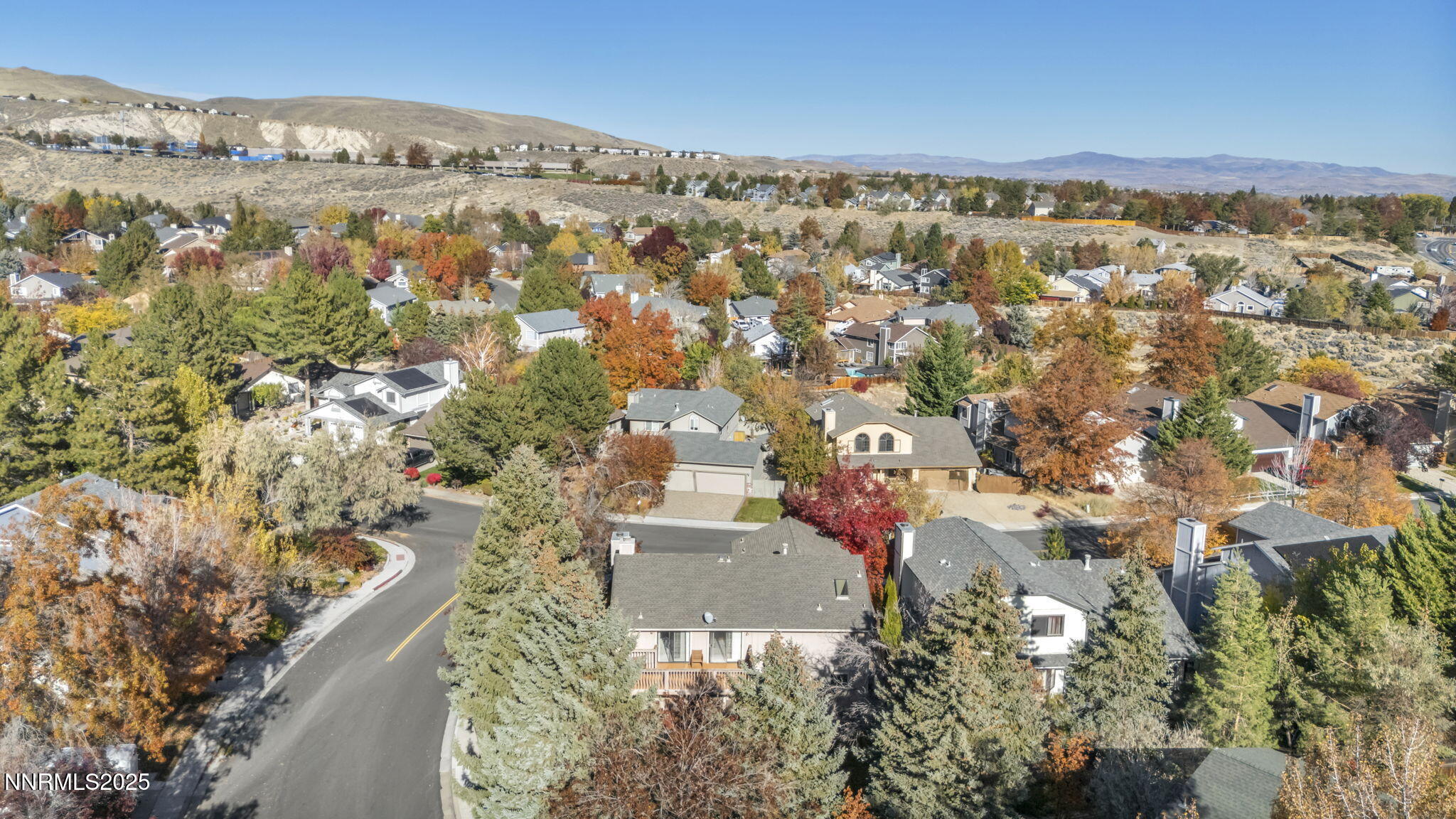 6299 Stone Valley Drive Reno, NV 89523 - Photo 57 of 70 an aerial view of residential building with parking space