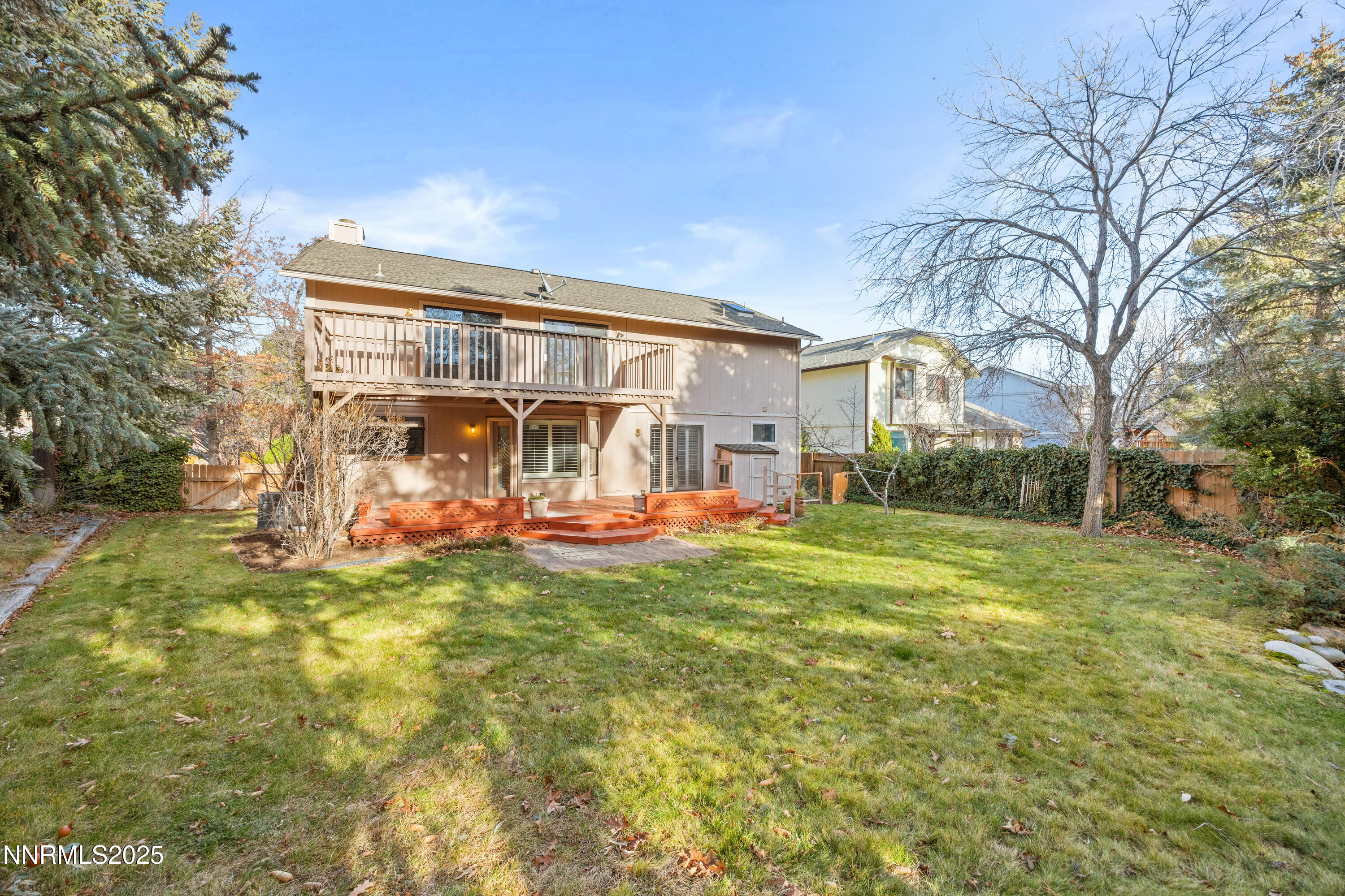6299 Stone Valley Drive Reno, NV 89523 - Photo 65 of 70 a view of a house with a big yard and large trees