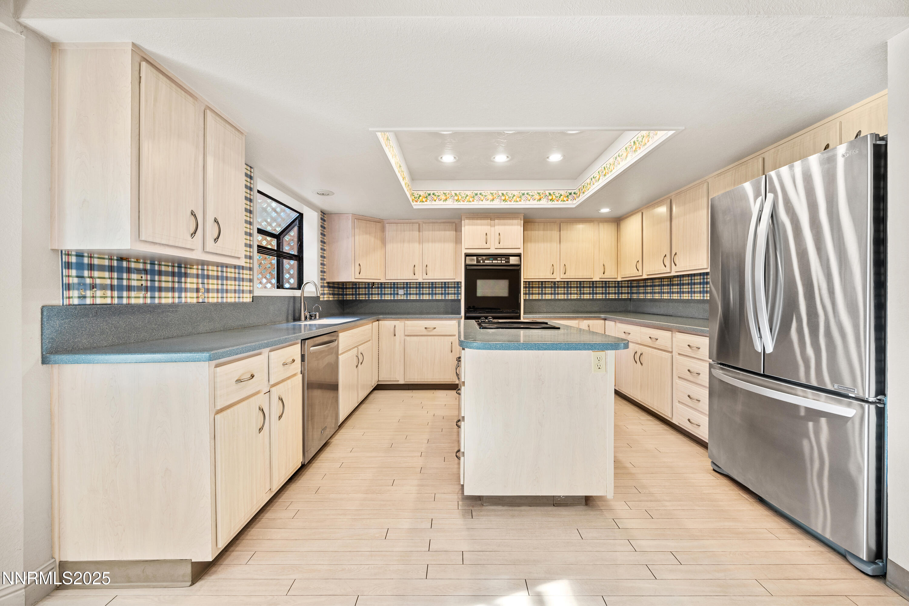6299 Stone Valley Drive Reno, NV 89523 - Photo 9 of 70 a kitchen with stainless steel appliances granite countertop a refrigerator sink and cabinets