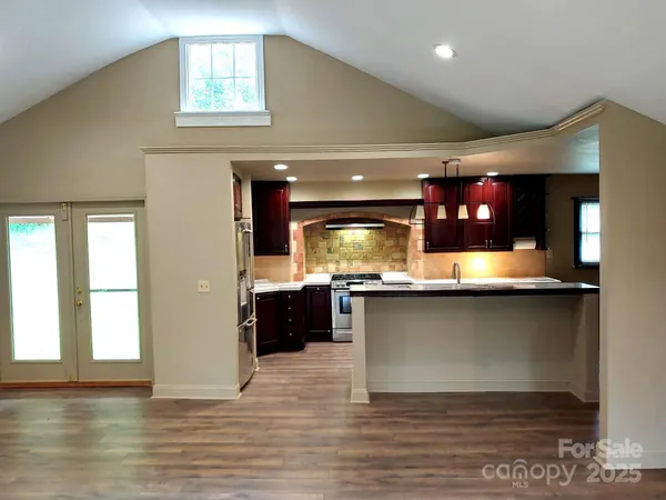 a kitchen with lots of counter space and window