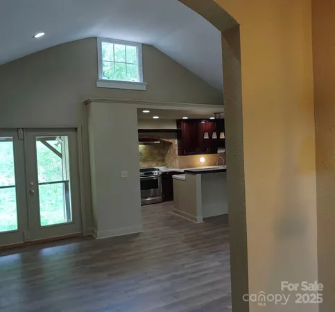 a kitchen with stainless steel appliances a refrigerator and microwave
