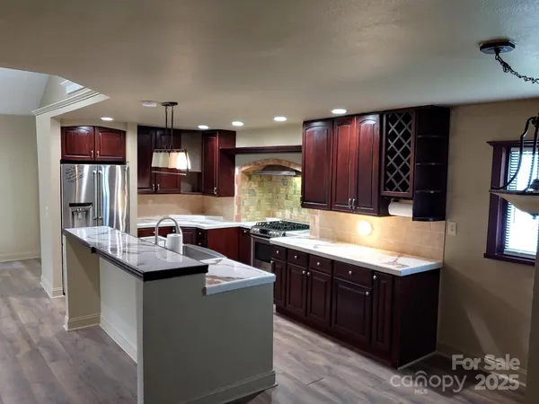 a kitchen with a stove and a sink