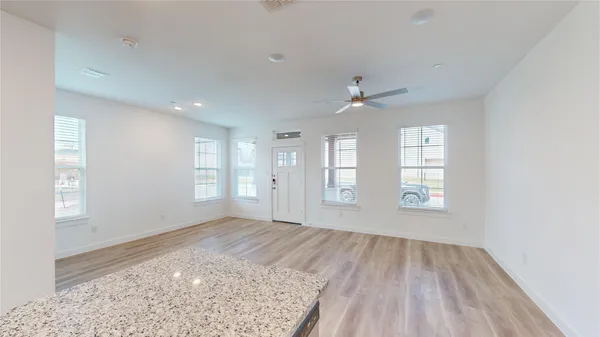 a view of an empty room with a window
