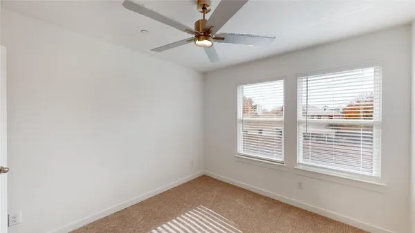 a view of a bathroom with sink mirror and shower