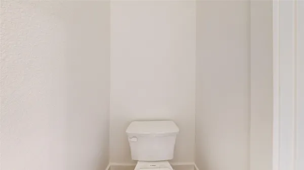 a bathroom with a double vanity sink toilet and shower