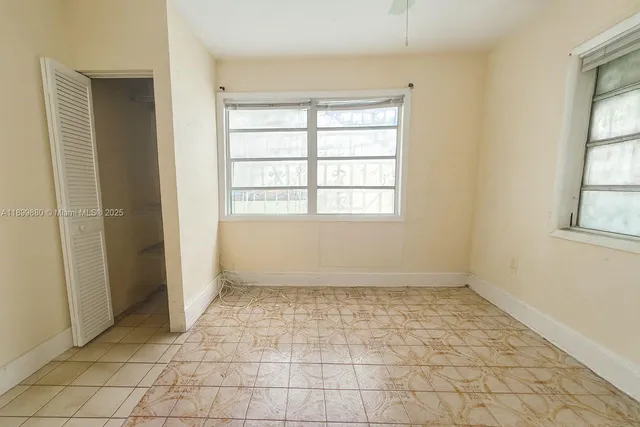 a bathroom with a sink a mirror and shower