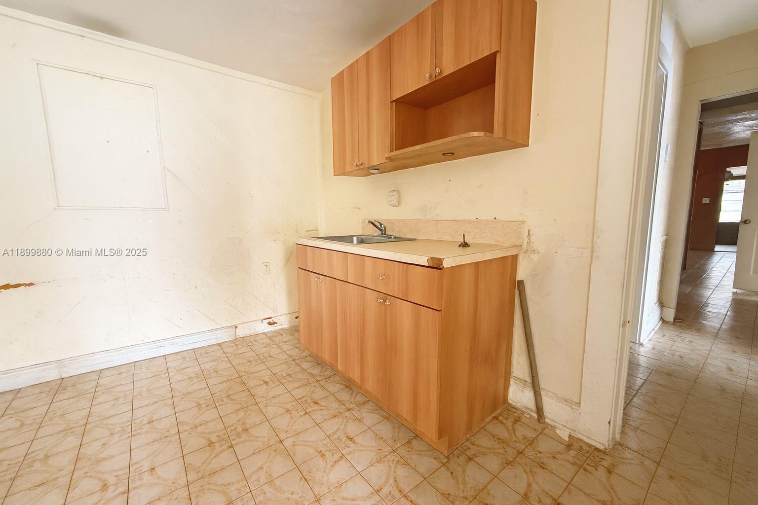 2228 Southwest 2nd Street Miami, FL 33135 - Photo 12 of 15 a bathroom with a sink a mirror and shower
