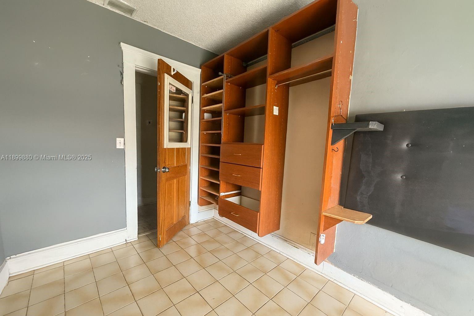2228 Southwest 2nd Street Miami, FL 33135 - Photo 14 of 15 a view of walk in closet and bedroom