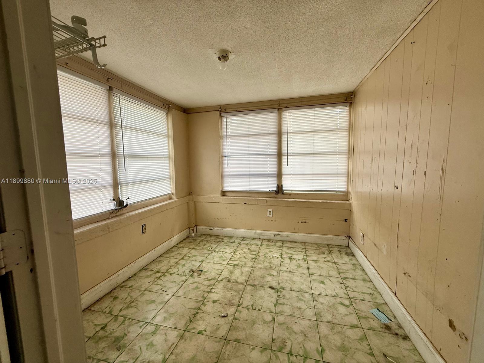 2228 Southwest 2nd Street Miami, FL 33135 - Photo 4 of 15 a bathroom with a bathtub and a shower