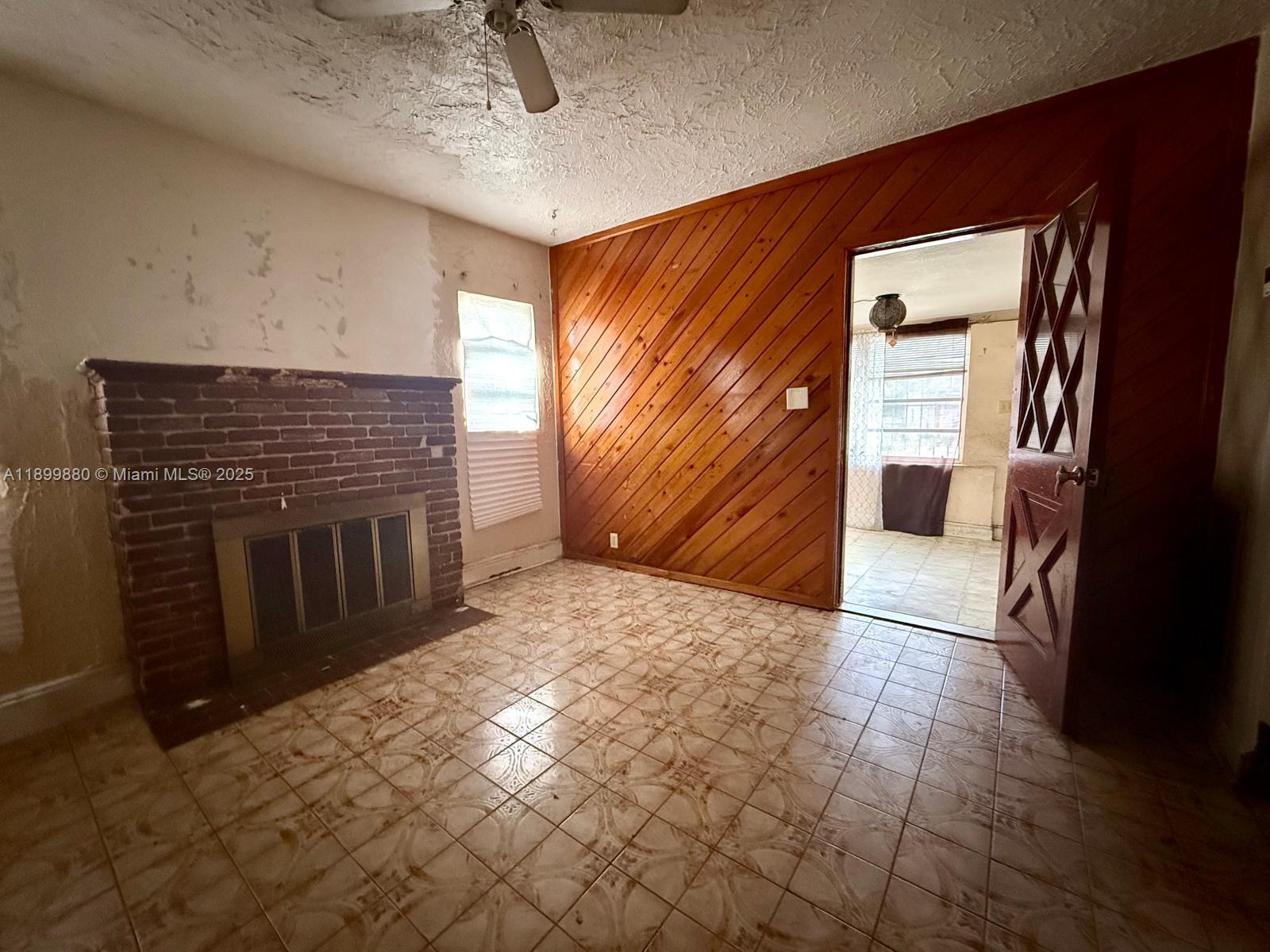 2228 Southwest 2nd Street Miami, FL 33135 - Photo 5 of 15 a view of an empty room and a fireplace