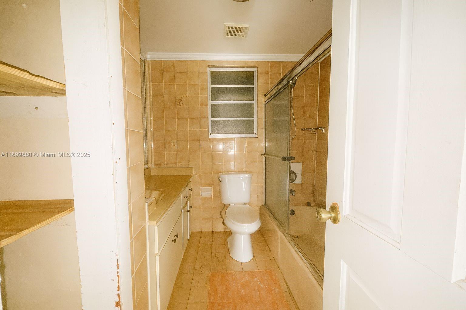 2228 Southwest 2nd Street Miami, FL 33135 - Photo 8 of 15 a bathroom with a shower and a toilet