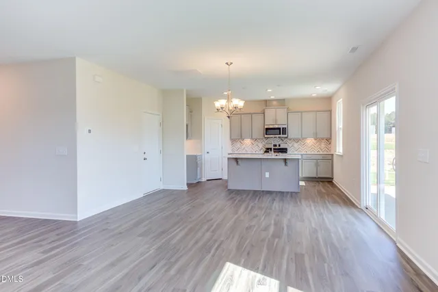 a view of kitchen with wooden floor