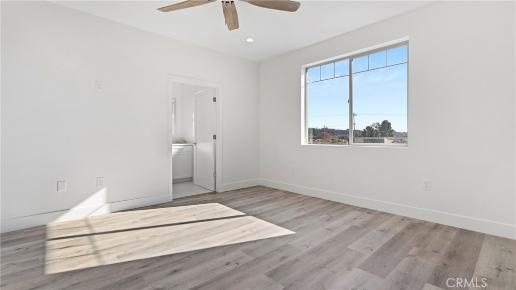 358 South Halcyon Road Arroyo Grande, CA 93420 - Photo 17 of 32 an empty room with wooden floor and windows