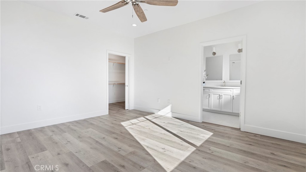 358 South Halcyon Road Arroyo Grande, CA 93420 - Photo 18 of 32 a view of a room with wooden floor and white walls