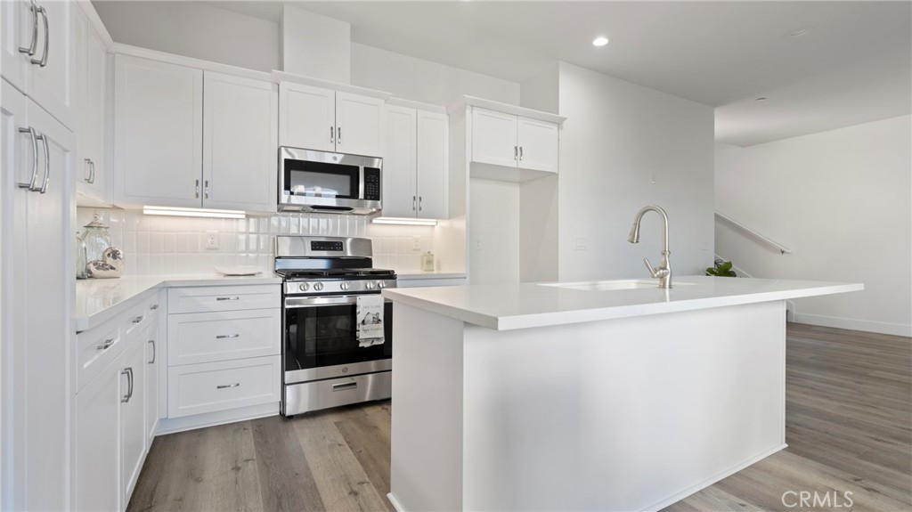 358 South Halcyon Road Arroyo Grande, CA 93420 - Photo 8 of 32 a kitchen with stainless steel appliances a refrigerator sink and microwave