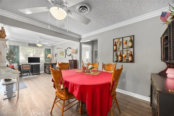 a spacious bedroom with a bed and a chandelier
