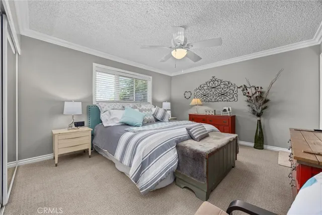 a bed room with a bed and a chair