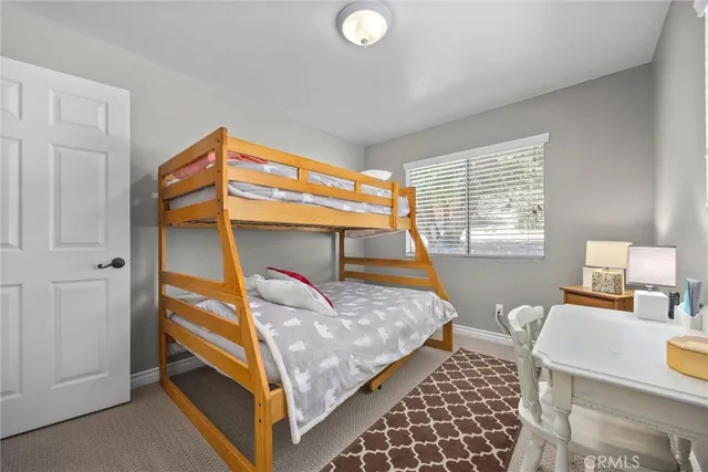 an aerial view of a house with a yard and potted plants