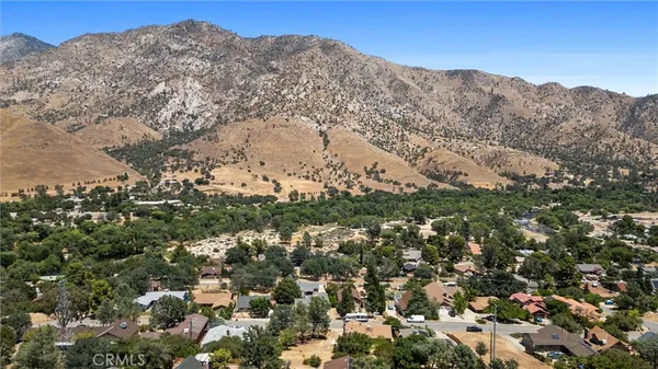 a view of a city with mountains in the background