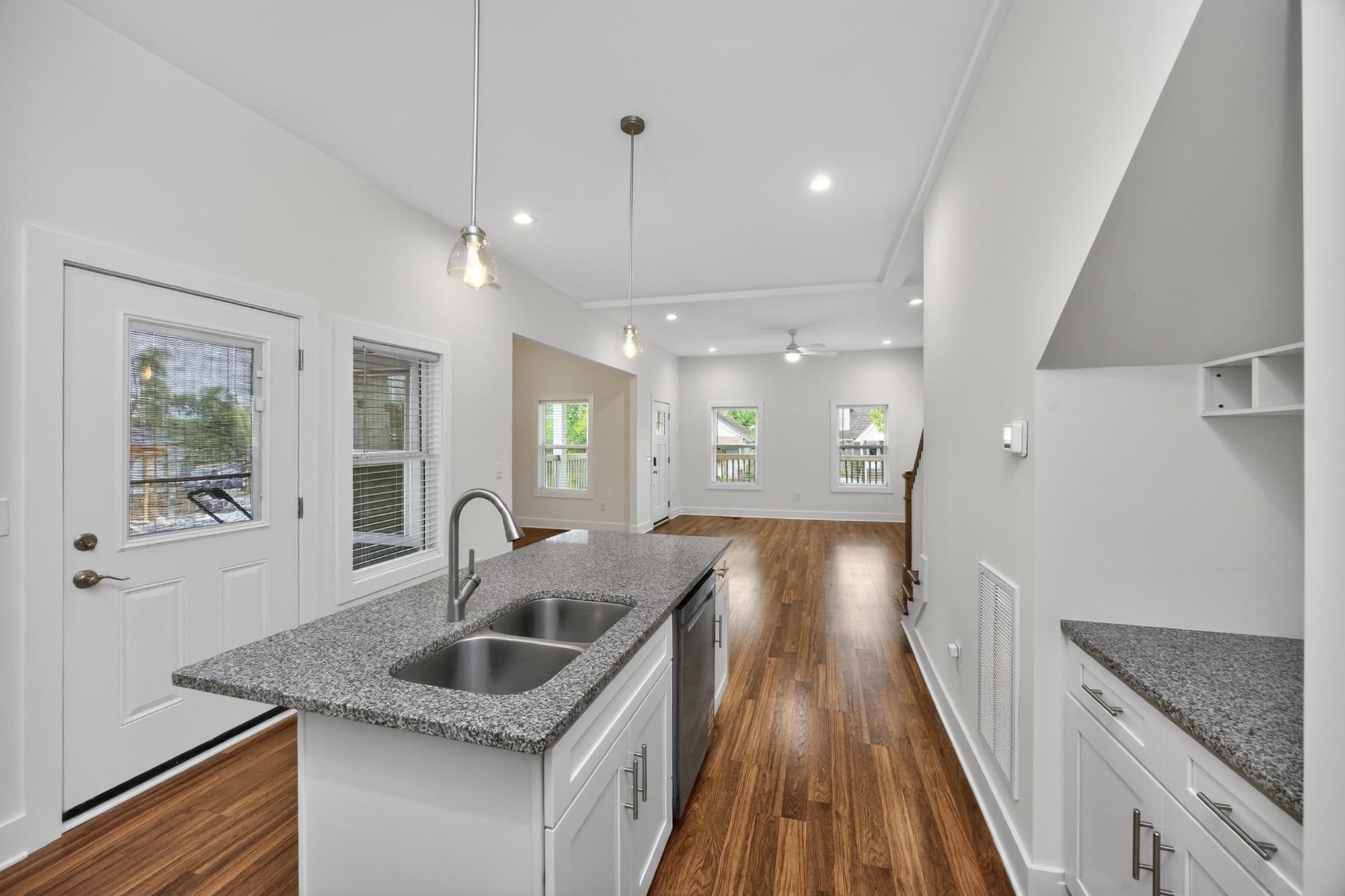 7 Decatur Street Nashville, TN 37210 - Photo 17 of 43 a kitchen with granite countertop a sink a counter space and stainless steel appliances