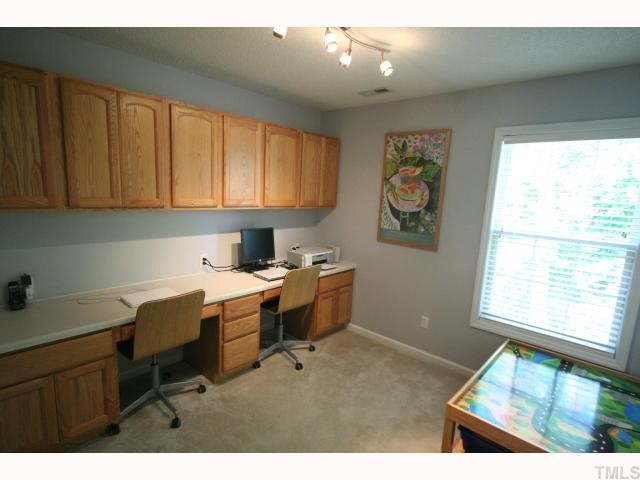 8509 Guerro Court Raleigh, NC 27613 - Photo 11 of 12 4th bedroom currently being used as an office. Desk and shelves are built in.
