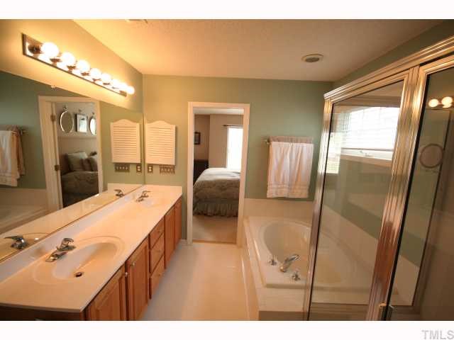 8509 Guerro Court Raleigh, NC 27613 - Photo 8 of 12 Master bath with tub and separate shower