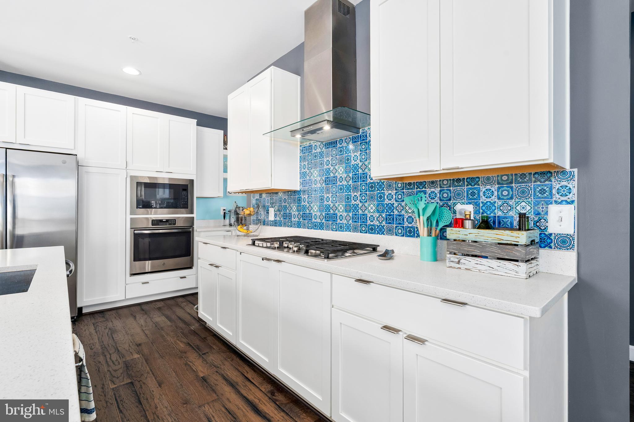 9915 Arapahoe Road New Market, MD 21774 - Photo 19 of 81 a kitchen with stainless steel appliances granite countertop a stove and a refrigerator