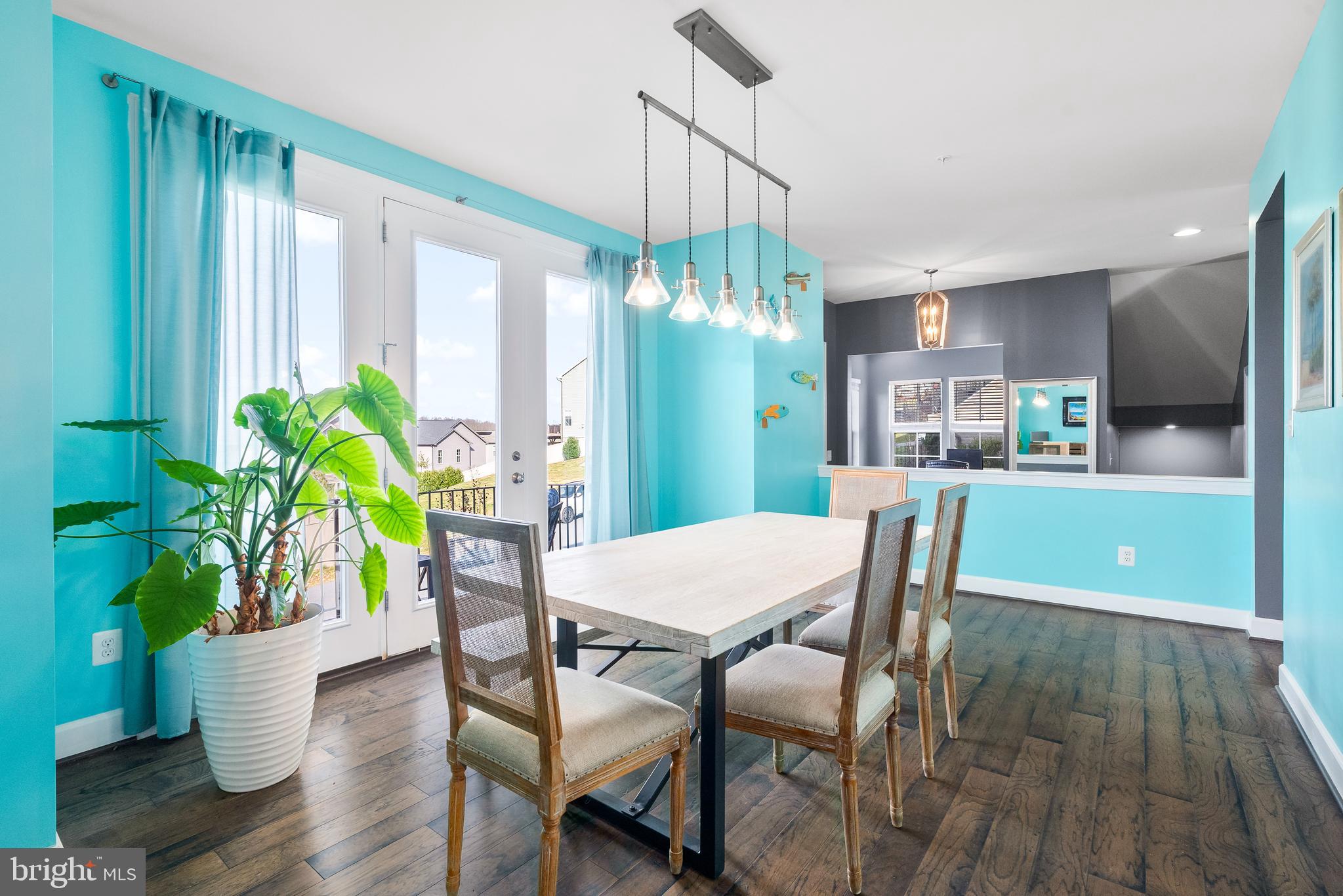 9915 Arapahoe Road New Market, MD 21774 - Photo 22 of 81 a view of a dining room with furniture window and wooden floor