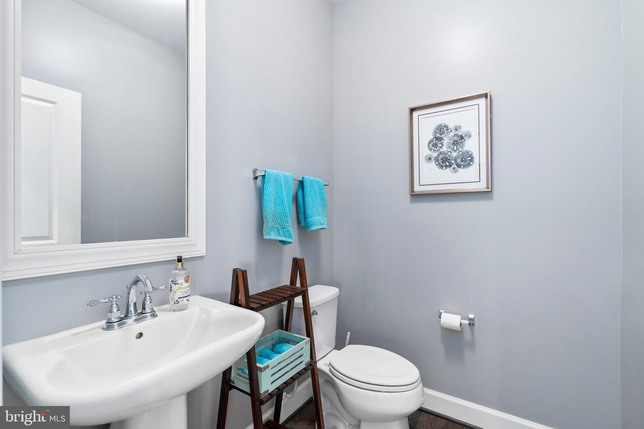 9915 Arapahoe Road New Market, MD 21774 - Photo 28 of 81 a bathroom with a toilet sink and mirror