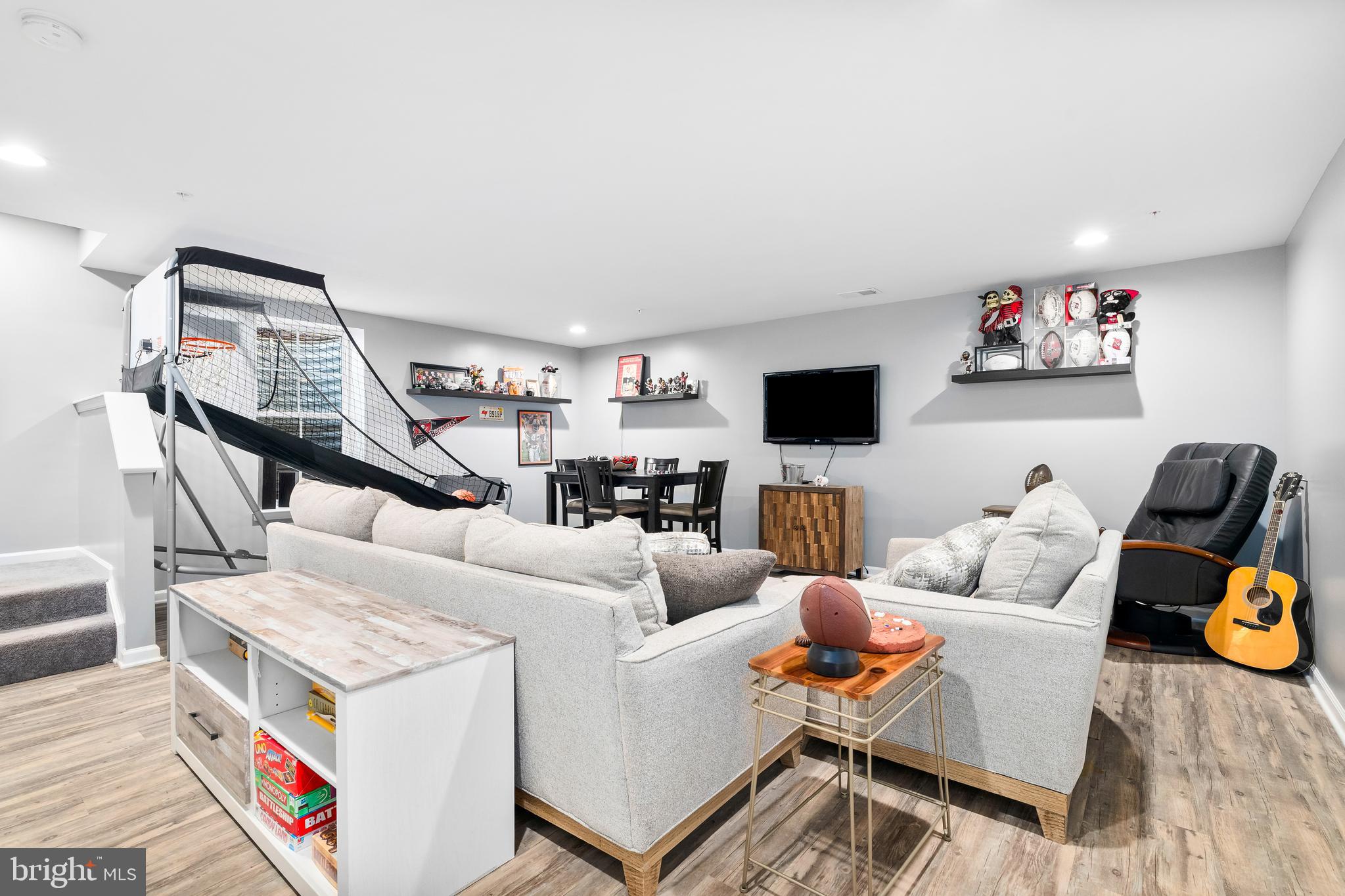9915 Arapahoe Road New Market, MD 21774 - Photo 45 of 81 a living room with furniture and a flat screen tv