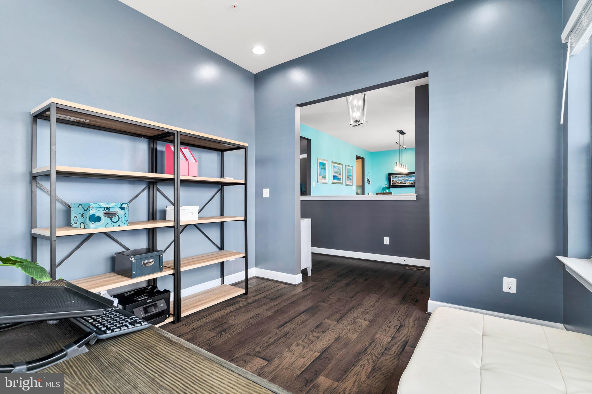 9915 Arapahoe Road New Market, MD 21774 - Photo 9 of 81 a view of a livingroom with furniture and cabinet