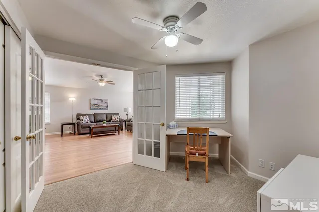 a view of a livingroom with furniture and a window