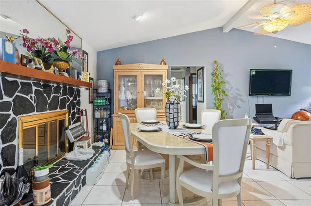 a dining room with furniture and window