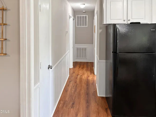 a view of a kitchen with a refrigerator