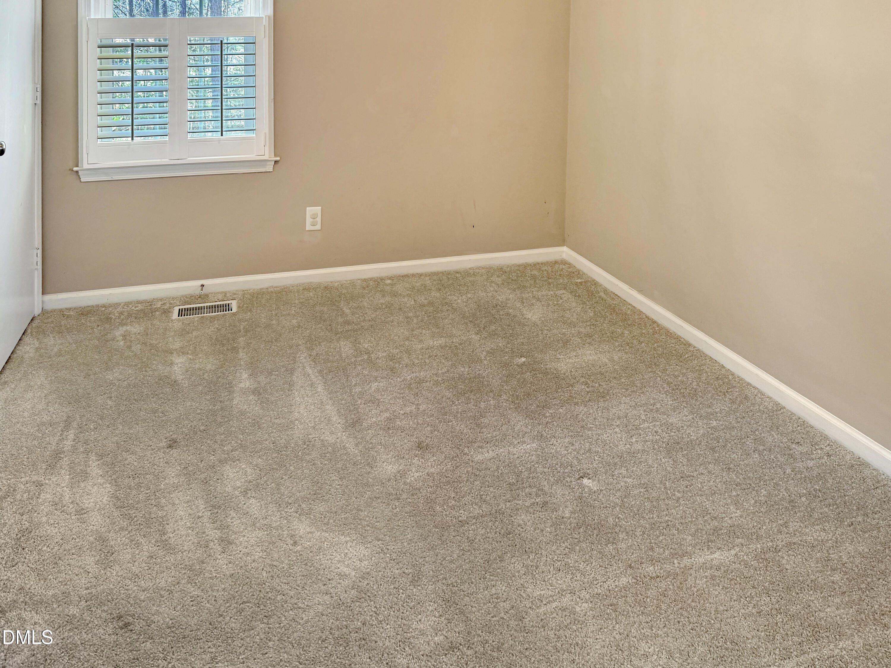 573 Arnold Road Louisburg, NC 27549 - Photo 12 of 16 an empty room with a window