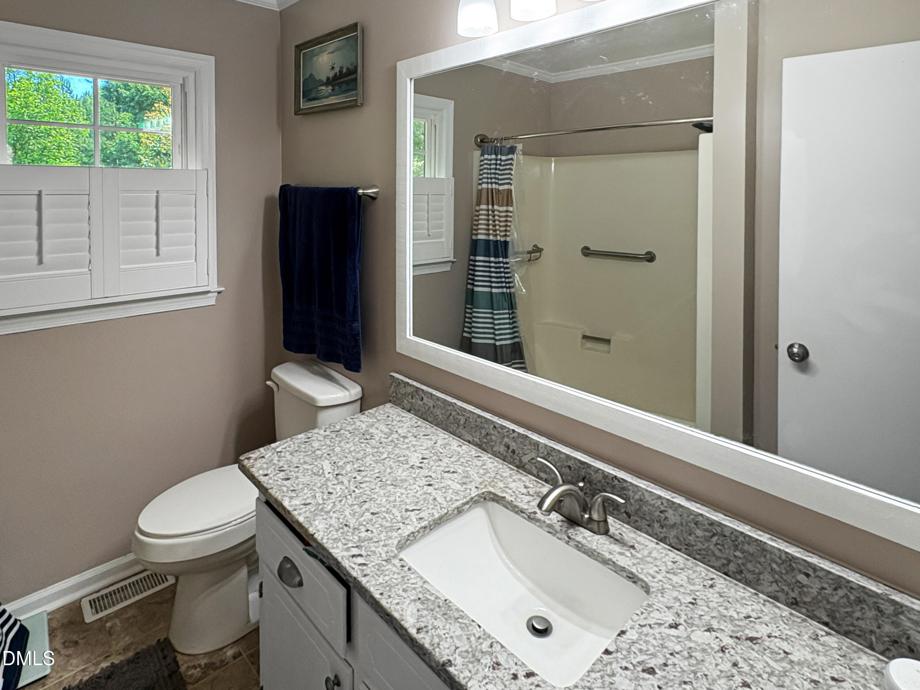 573 Arnold Road Louisburg, NC 27549 - Photo 13 of 16 a bathroom with a sink a toilet and shower