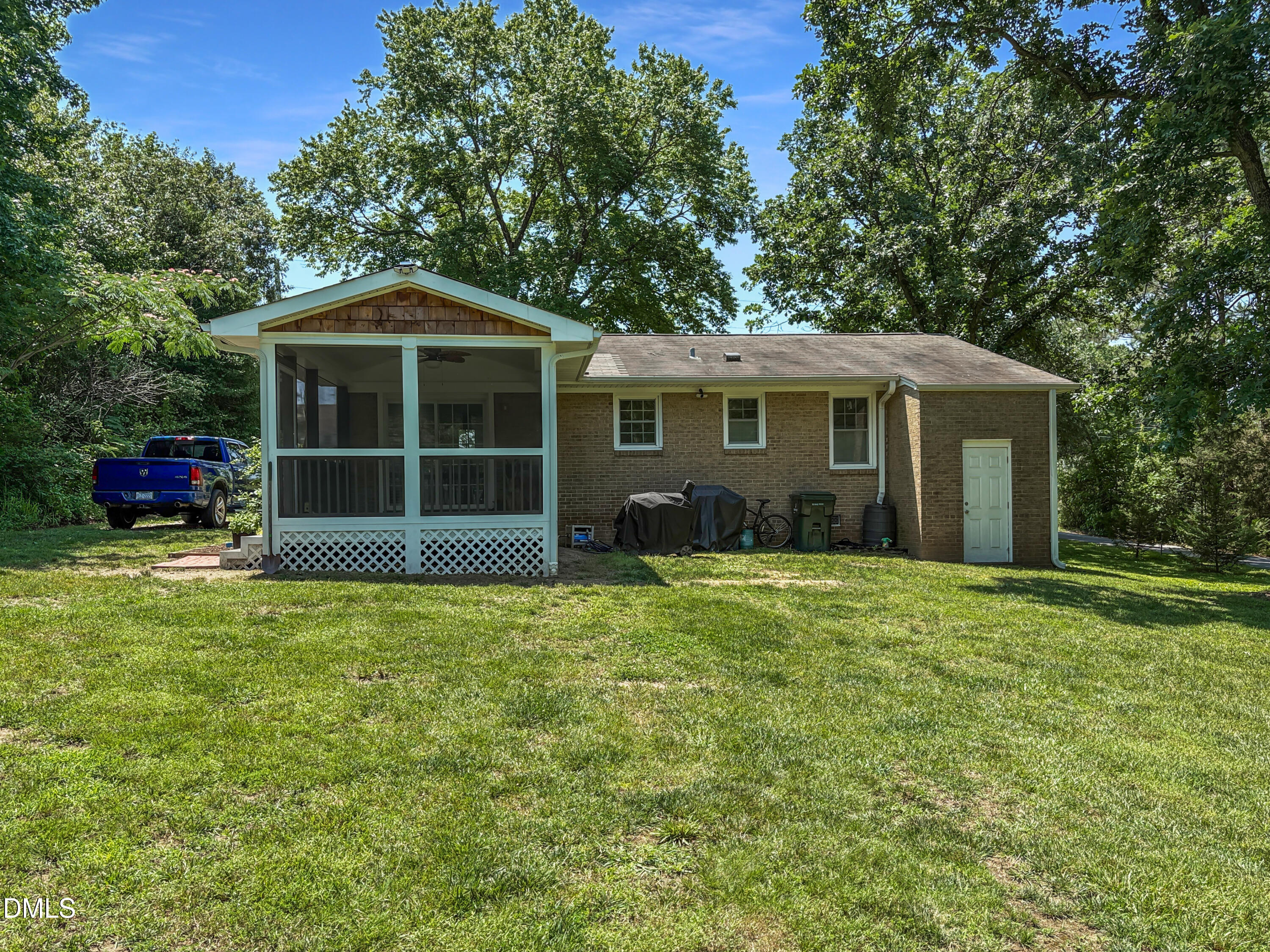 573 Arnold Road Louisburg, NC 27549 - Photo 3 of 16 a front view of a house with a garden