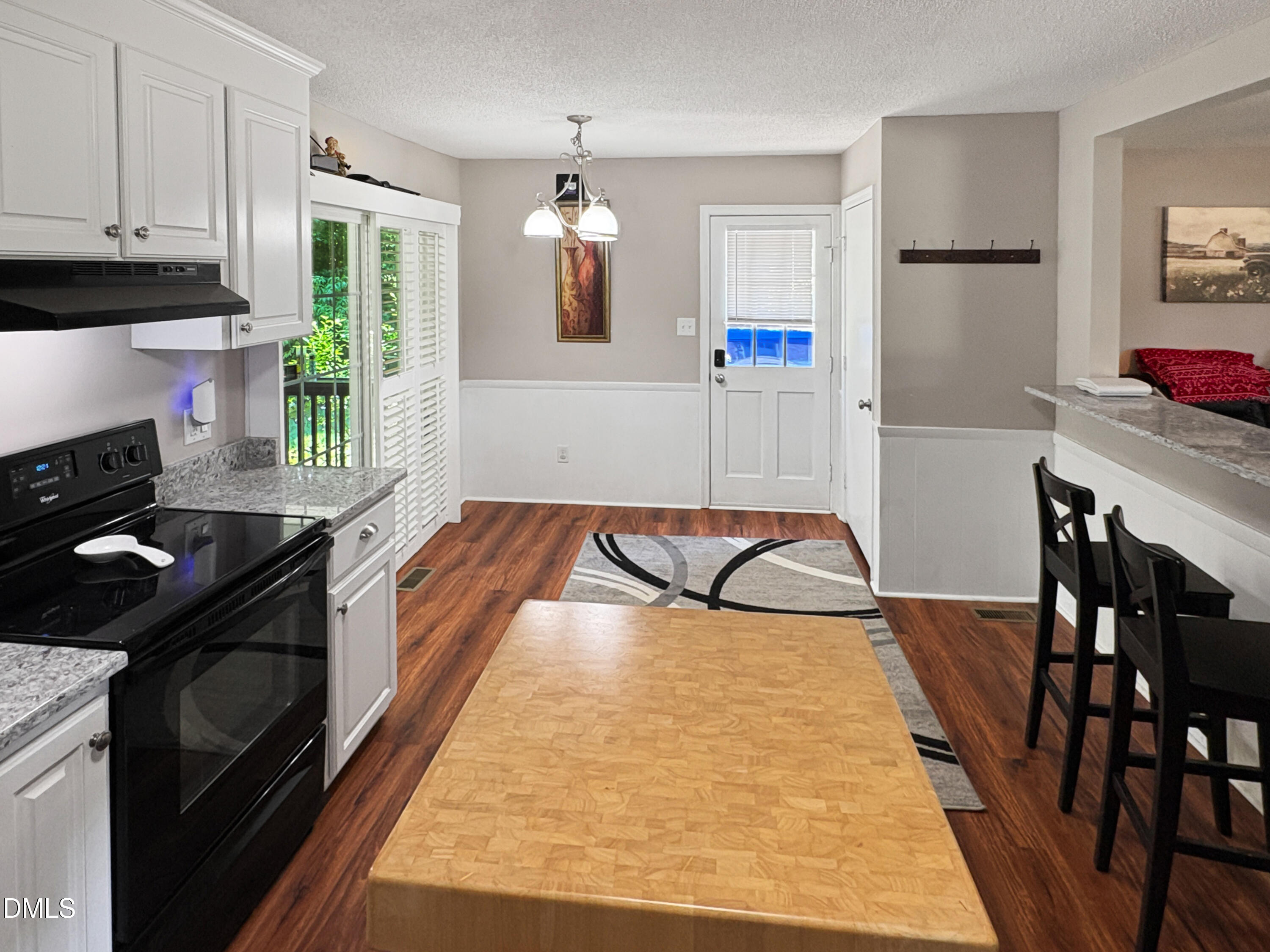 573 Arnold Road Louisburg, NC 27549 - Photo 6 of 16 a kitchen with stainless steel appliances granite countertop a refrigerator a stove and a refrigerator