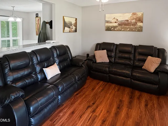 a living room with furniture or couch and a window
