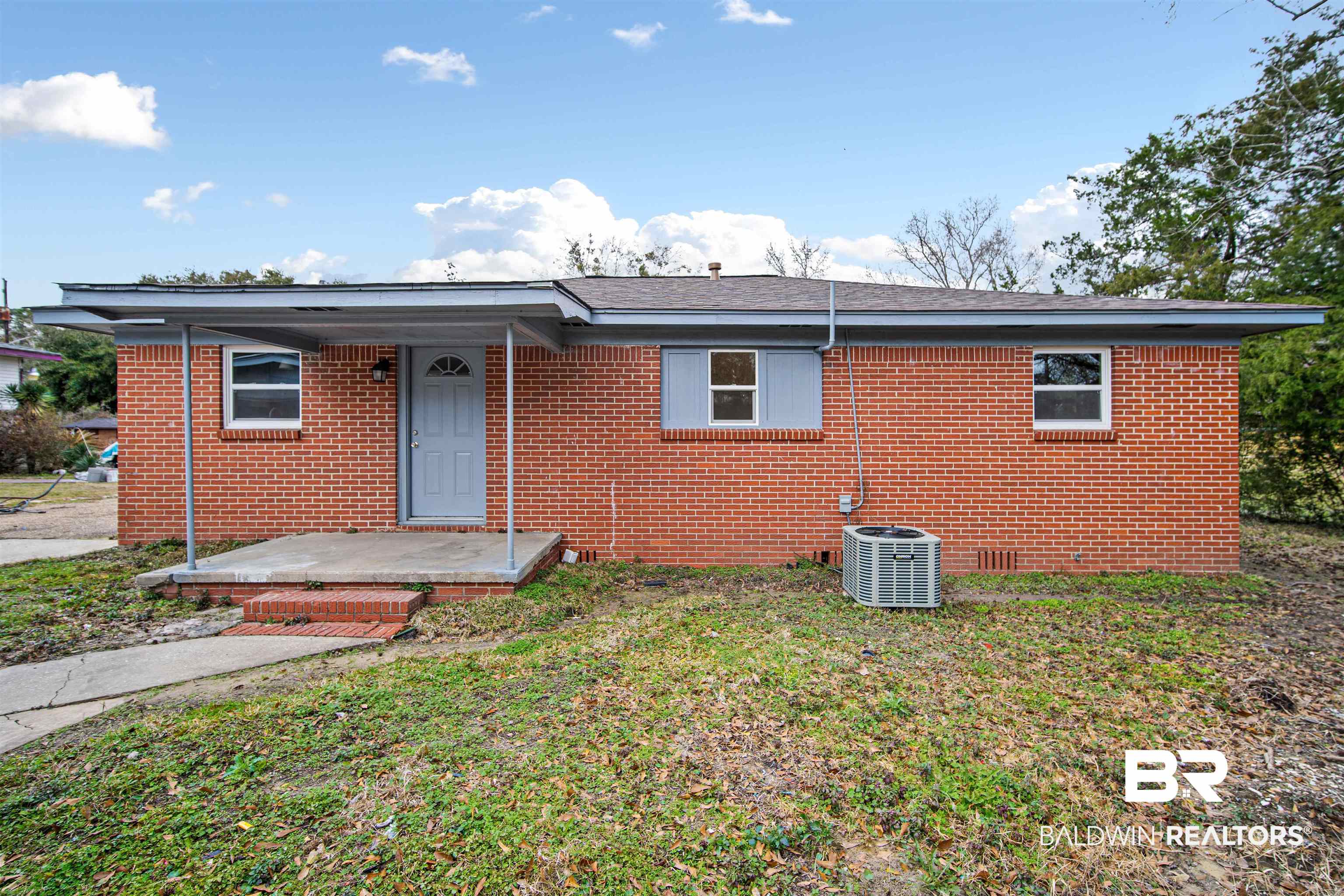 2119 Autrey Avenue Eight Mile, AL 36613 - Photo 19 of 22 View of front of property with central AC and a front lawn