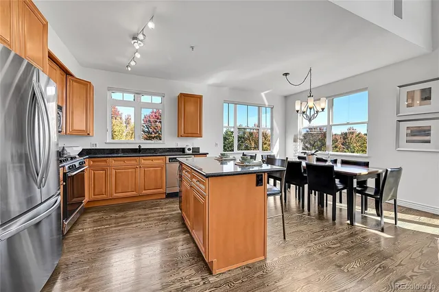 a kitchen with lots of counter top space and dining table