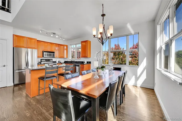 a view of a dining room with furniture window and wooden floor