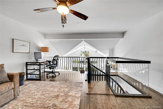 a view of a livingroom with furniture and stairs