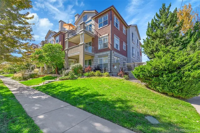 a view of a building with a yard