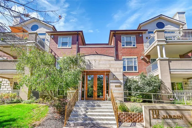 a front view of house with a garden