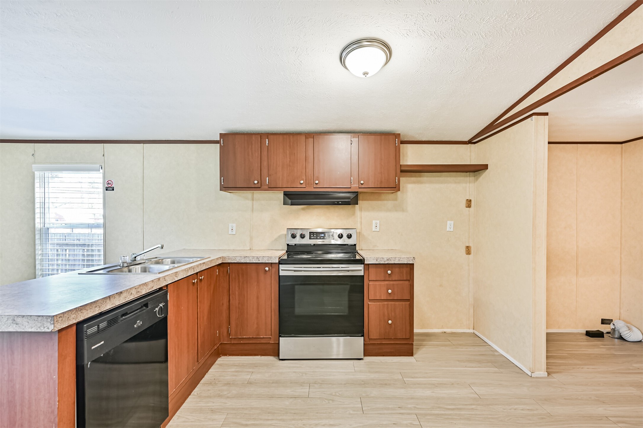4702 10th Street Bacliff, TX 77518 - Photo 11 of 33 a kitchen with stainless steel appliances granite countertop a stove and a sink